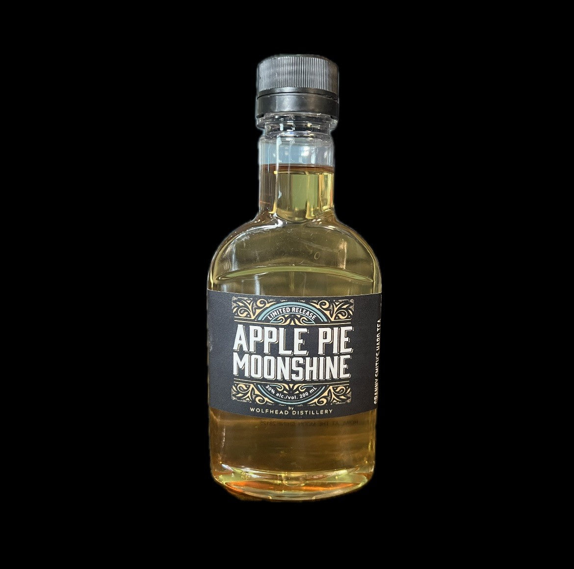 Bottle of Apple Pie Moonshine with a black label on a white background