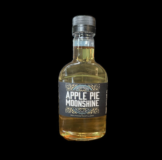 Bottle of Apple Pie Moonshine with a black label on a white background